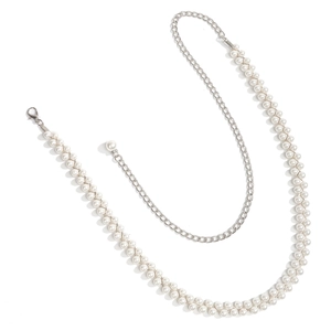 Detail of double-layer faux pearl waist chain with silver alloy links and lobster clasp