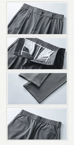 Dettaglio dei pantaloni dritti grigio scuro con vita elastica e trama in saia