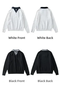 Detailweergave van polo sweaters met rits in zwart en wit met contrastkraag en geribde boorden