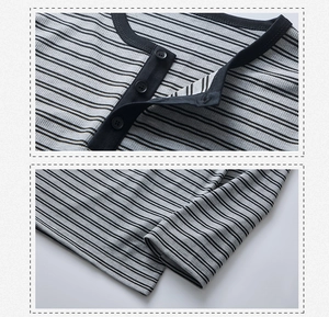 Detail macro-opname van de gestreepte Henley-kraag met drie knopen en nette afwerking