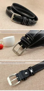 Detail view of black waist belt with white stitching and silver alloy pin buckle