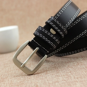 Black leather skinny belt for women featuring white contrast stitching and silver buckle
