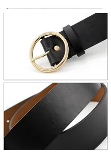Detailed view of women black leather belt texture and golden round buckle closure