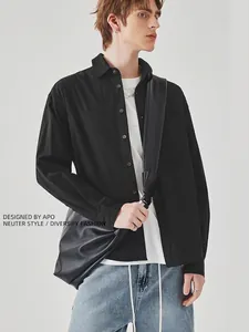 Men's casual black long sleeve shirt with chest pocket and relaxed fit on model