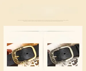 Detail of vintage flower engraved bronze buckle and floral embossed black leather belt