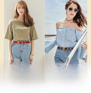 Detail of genuine leather skinny belts in red and brown colors with a floral buckle finish