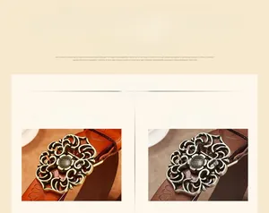 Détail de la boucle en métal ajouré à fleurs et de la texture du cuir marron sur la ceinture