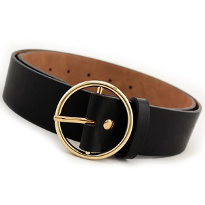 Classic black leather women belt with polished gold round buckle on neutral background