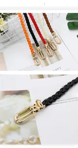 Macro shot of colorful woven PU skinny belts with elegant golden U-shaped metal buckles