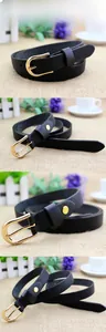 Detailed close-up of a black Saffiano leather belt with a polished gold horseshoe buckle