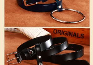 Détail de ceintures vintage en cuir avec grands anneaux argentés et clous en noir et marine