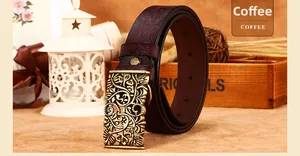 Macro view of coffee brown embossed leather belt with vintage floral hollow buckle