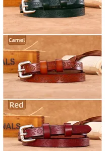 Detail of genuine leather skinny belt for women with embossed floral patterns and silver buckle