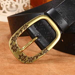 Vintage black leather belt with floral embossing and antique bronze oval buckle