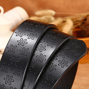 Retro black leather belt for women featuring continuous embossed daisy floral patterns
