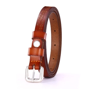 Women's vintage brown leather belt featuring embossed floral patterns and a silver buckle