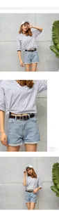 Detail of blue and white striped V-neck cotton shirt with side knot and brown leather belt