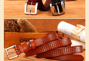 Detail of hollowed-out genuine leather belts with silver buckle in multiple colors