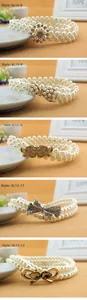 Detail display of pearl waist belts featuring floral and bow metal buckle styles