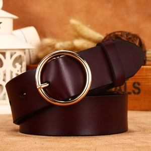 Deep burgundy leather belt with a polished gold round buckle for women stylish jeans