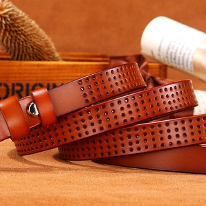 Women's hollowed brown leather belt with round perforations and silver buckle