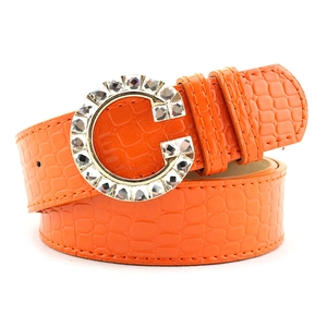 Orange faux crocodile leather belt for women featuring a large sparkling rhinestone G buckle