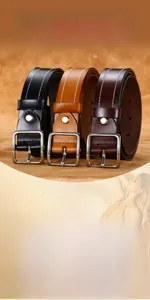 Detailed view of genuine leather belts in black and brown with silver buckle and white stitching