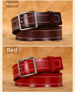 Detailed view of leather belts in coffee and red with distinct white contrast stitching