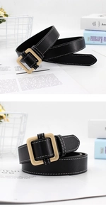 Close-up of black leather belt with square gold buckle and white double-row stitching detail