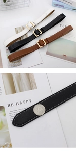 Detail view of thin leather belts with gold square buckles and contrast stitching for women