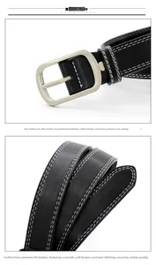 Close-up of matte silver buckle and black PU leather belt with white stitching detail