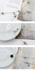 Detailed shot of pearl and metal beads waist chain with lobster clasp for dresses