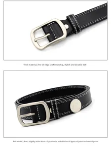 Detail showing 2.8cm wide black leather belt with white stitching and silver buckle