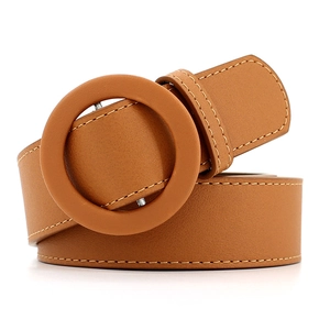 Minimalist caramel brown leather belt for women featuring a large round leather-covered buckle
