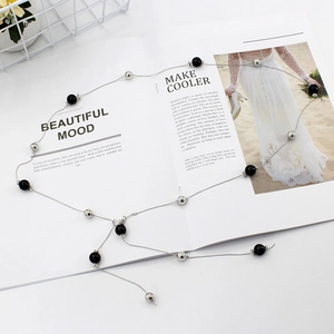 Elegant silver chain belt for dresses featuring alternating pearls and black sphere beads