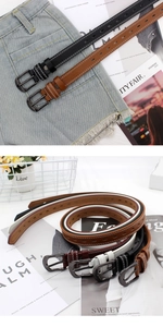 Detail view of colorful slim hollow leather belts with vintage buckles for women