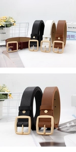 Close-up of four colors of retro minimalist leather belts with golden square metal buckles