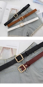 Detail view of retro PU leather belts with square gold buckles in multiple colors