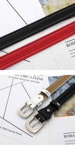 Detail of skinny leather belts with white stitching and silver buckles in four colors