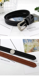 Detail of retro faux leather belt with double stitching and metal pin buckle