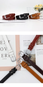 Detail view of colorful PU leather belts with silver buckle and double-stitch edges