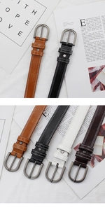 Detail view of multi-color PU leather belts with contrast stitching and silver D-buckles