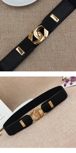 Detail showing the shiny gold interlocking buckle and black elastic belt for dresses
