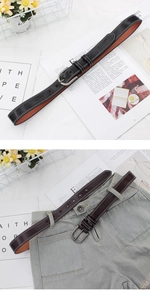 Detail of casual PU leather belt featuring double white stitching and vintage metal buckle