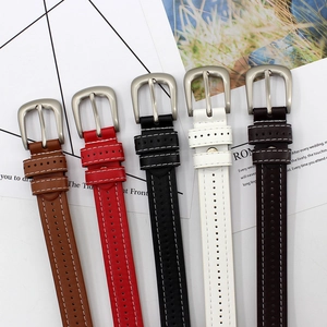 Five thin faux leather belts with white stitching and silver matte metal buckles in various colors
