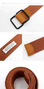 Detail of brown woven canvas belt with black metal double D-ring buckle and reinforced tip