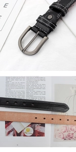 Detail of buckle and contrast stitching on casual PU leather belts in black and brown colors