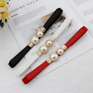 Lot de trois ceintures élastiques pour femmes avec boucle perle en noir blanc et rouge