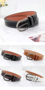 Detail of pin buckle PU leather belt with white double stitching and matte D-ring buckle