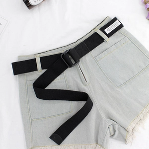 Light blue denim shorts with a black canvas double D-ring belt and distressed hem detail